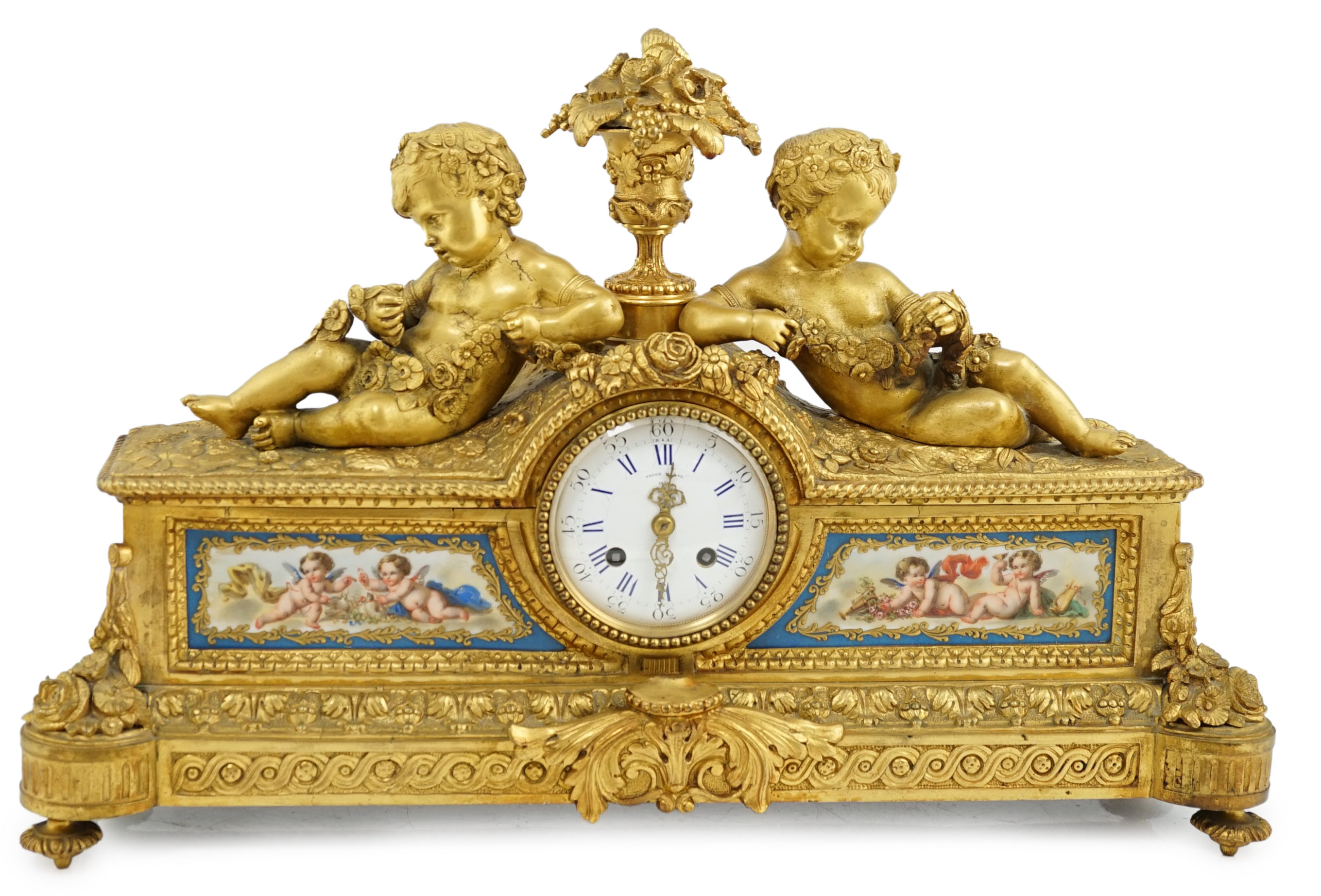 A 19th century French ormolu and Sevres style porcelain mantel clock